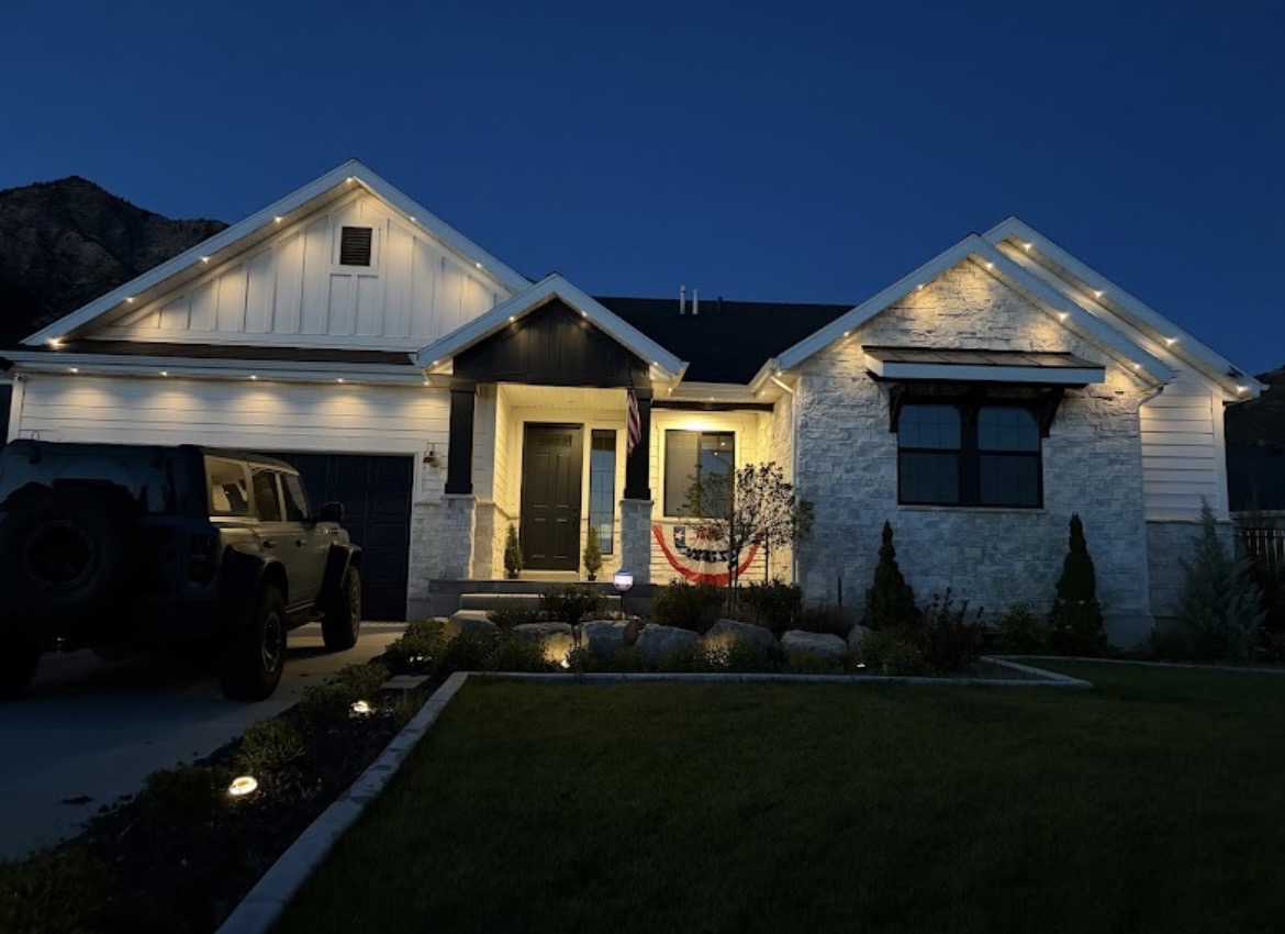 Warm white permanent LED lighting installed along a home's roofline